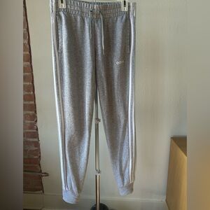 Addidas sweatpants, jersey material, white stripes on the side.